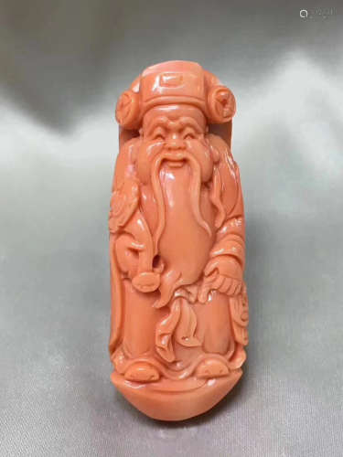 A RED CORAL WEALTH GOD PENDANT
