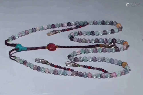 A STRING OF TOURMALINE COURT BEADS