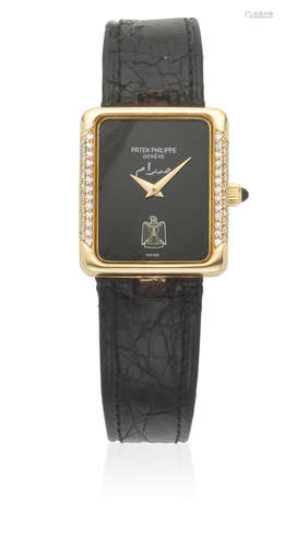 Ref: 4311, Circa 1980  Patek Philippe. A lady's 18K gold and diamond set manual wind rectangular wristwatch with Middle Eastern emblem