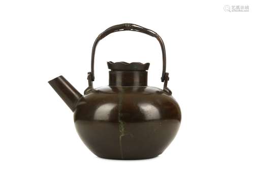 A BRONZE KETTLE AND COVER. 17th Century. With a compressed globular body, the shoulder flanked by a