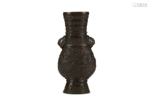 A BRONZE VASE. Ming Dynasty. Of compressed pear-shaped form, with a waisted neck and slightly