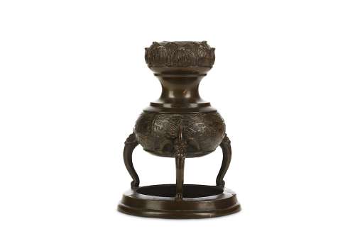 A CHINESE TRIPOD BRONZE INCENSE BURNER. Yuan to Ming Dynasty. The globular body decorated with