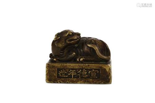 A CHINESE BRONZE ‘QILIN’ WEIGHT. Ming Dynasty. Cast as a seated the head turned to the left, the