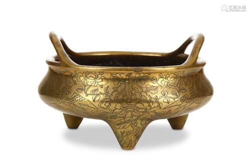 AN INCISED CHINESE BRONZE TRIPOD LOOP HANDLED INCENSE BURNER. Late Qing Dynasty. Supported on
