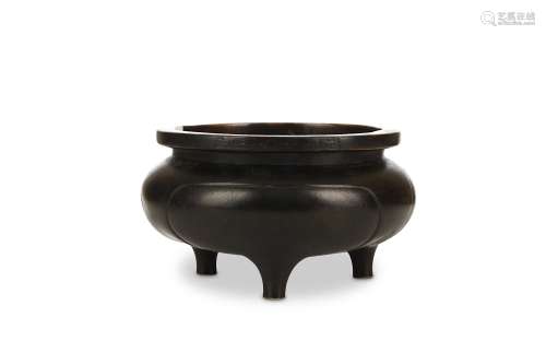 A CHINESE BRONZE INCENSE BURNER. 17th Century. The compressed globular body rising on three short