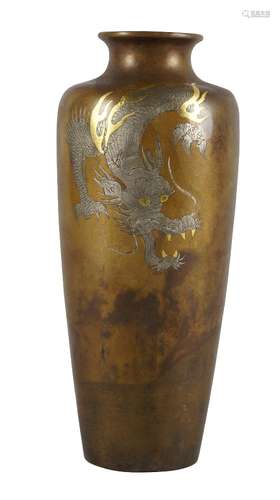 A Japanese bronze silver and gold inlaid vase, late Meiji period, decorated with a snarling