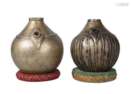 Two Tibetan bronze globular hookah bases, 19th century, one lobed, both on woven ring pads, 18cm