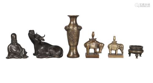 Six Chinese bronzes, 17th-19th century, comprising two scroll weights modelled as a buffalo, 8.5cm