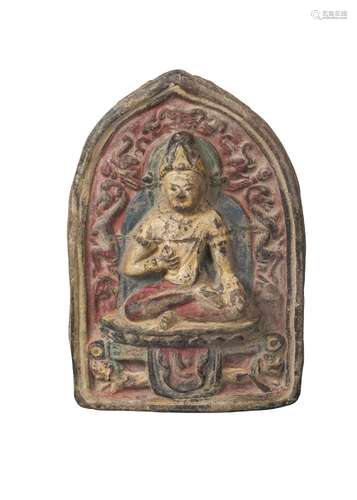 A Tibetan painted terracotta votive plaque, mid-19th century, of arched form, depicting Maitreya,