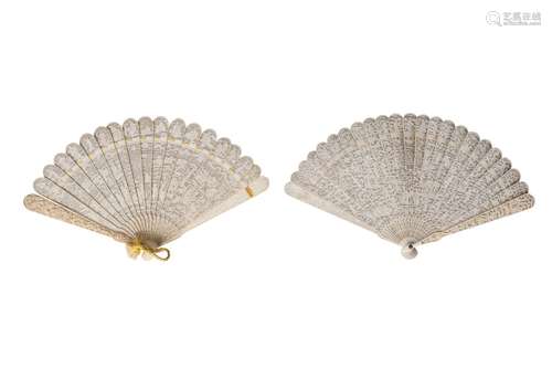 Two Chinese Canton ivory brise fans, mid 19th century, each finely carved with figures in a