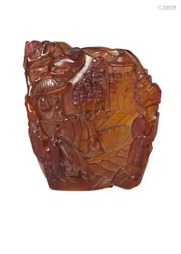 A Chinese amber carving, 19th century, carved with a priest ringing a temple bell in a mountain