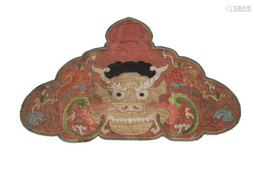 A Sino-Tibetan cloud collar, 18th/19th century, embroidered with a dragon's head, 46cm x 63cm