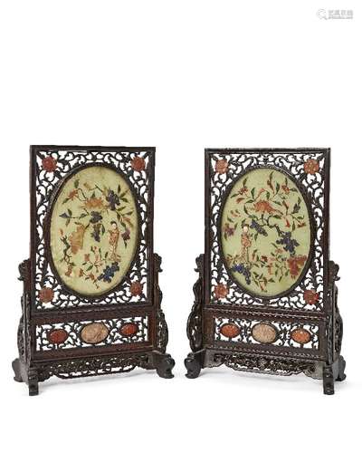 A pair of Chinese hardstone and carved wood table screens, early 20th century, with oval green