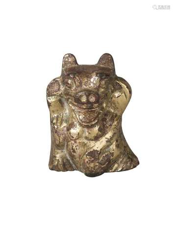 A Chinese gilt bronze fitting, Han dynasty, modelled as a bear, standing with paws held aloft and