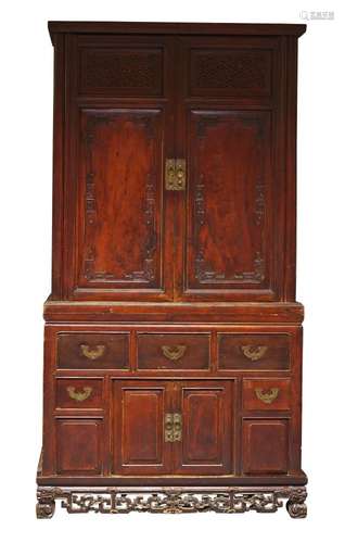 A Chinese hardwood two-section cupboard, late Qing dynasty, the upper section with pair of doors