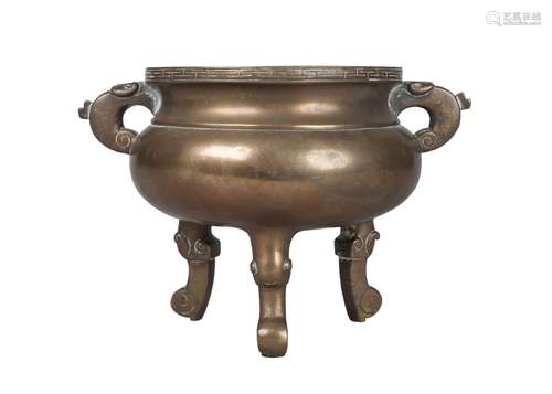 A Chinese bronze tripod censer, 18th/19th century, with archaistic handles, compressed body,