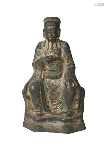 A Chinese parcel gilt bronze figure of an official, Ming dynasty, 16th/17th century, seated with