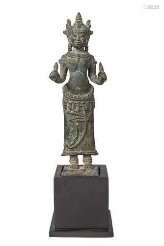 A Khmer Bayon style bronze figure, 13th century, depicting Prajnaparamita standing, wearing