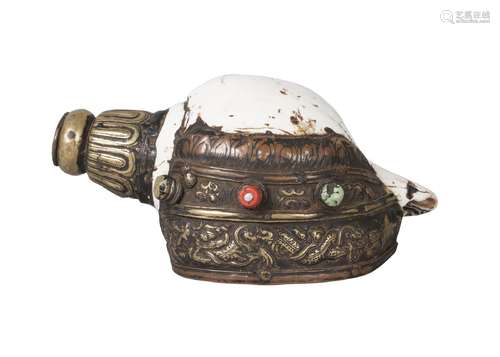 A tibetan ritual conch shell, 19th century, with repousse brass mounts decorated with a sinuous