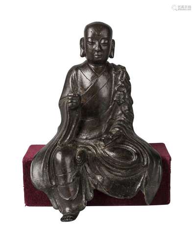 A Chinese bronze seated Lohan, Ming dynasty, 16th/17th century, seated at 'Royal Ease', with