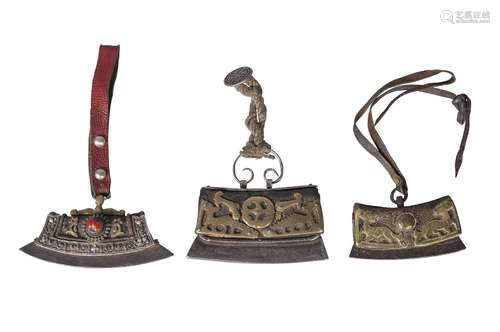 Three Tibetan tinder pouches, 19th century, two with brass mounts pierced as animals, 10.5cm and