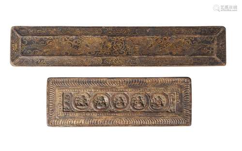 Two Tibetan wooden manuscript covers, 15th-16th century, one painted in gilt with dragons, the other