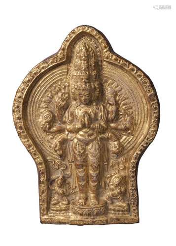 A Tibetan gilded terracotta plaque of Avalokitesvara, 18th century, depicted with eleven heads, with