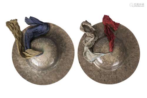 A pair of Tibetan beaten brass cymbals, 19th century, with cloth handles and painted decoration to