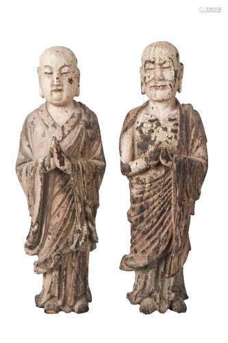 A pair of Chinese carved wood and painted gesso Lohan, 18th/19th century, both carved standing, with