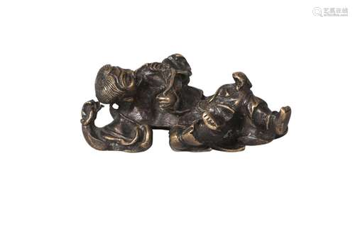 A Chinese bronze scroll weight, Ming dynasty, 17th century, modelled as Liu Hai reclining, holding