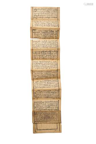 A Tibetan manuscript, early 20th century, inscribed with Buddhist mantra, wrapped in a red cloth,