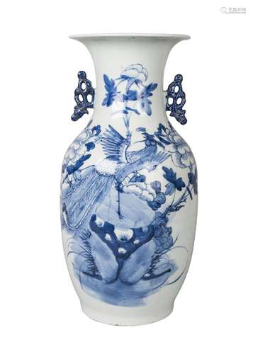 A Chinese porcelain baluster vase, mid-19th century, painted in underglaze blue with a peacock