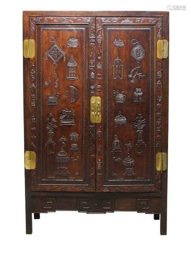 A Chinese huali wood cabinet, 19th century, with pair of doors carved in low relief with