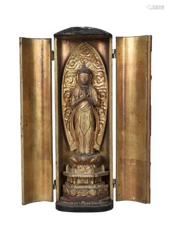 A Japanese lacquered and gilt wood Zushi shrine, 18th century, the pair of doors enclosing Buddha