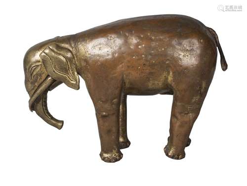 A Tibetan gilt copper alloy figure of an elephant, 19th century, standing four square, 15cm high,