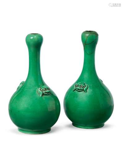 A pair of Chinese monochrome apple green porcelain garlic-head vases, 18th century, with bulbous