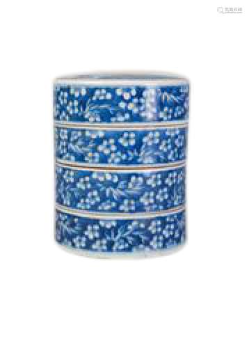 A Chinese porcelain four section cylindrical box, late Qing dynasty, painted in underglaze blue to