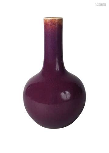 A Chinese porcelain pale aubergine glazed bottle vase, Qing dynasty, 18th century, with rich