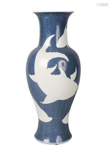 A Chinese porcelain reverse-decorated baluster vase, mid-19th century, decorated with white fish