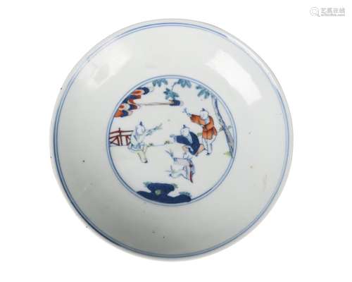 A Chinese porcelain saucer dish, Yongzheng mark, Republic period, painted in underglaze blue and