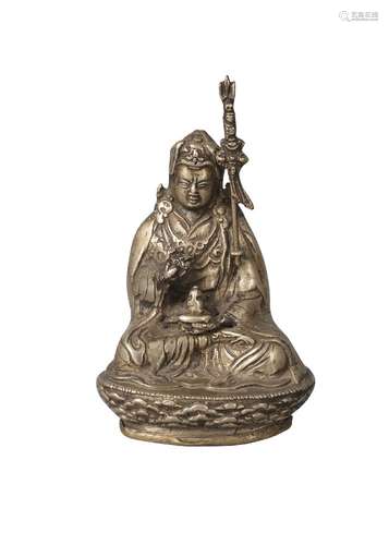 A Tibetan bronze figure of Padmasambhava, late 19th/early 20th century, seated on a lotus base,