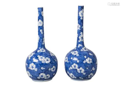 A pair of Chinese porcelain bottle vases, late 19th/early 20th century, painted in underglaze blue