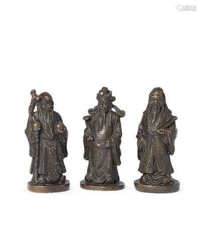 Three Chinese bronze scroll weights depicting The Three Star Gods, late Qing dynasty, depicting