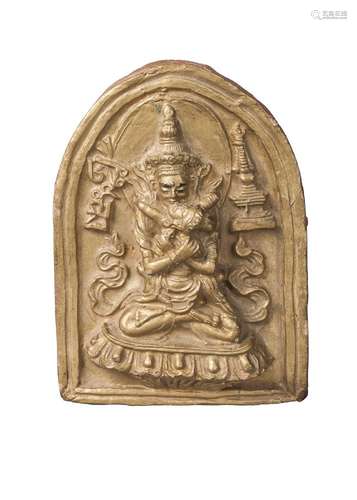 A Tibetan gilt terracotta votive plaque of Samvara, 19th century, depicted with consort in vab-