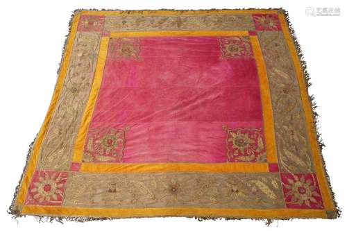 A large Turkish table cover, c.1900, decorated with couched gold thread on a crimson ground, 230cm x