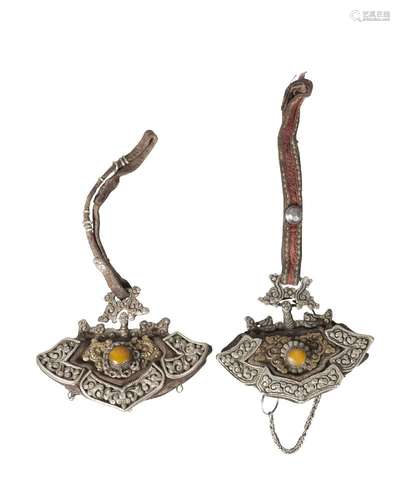 Two Tibetan gilt and white metal mounted leather tinder pouches, 19th century, each decorated with