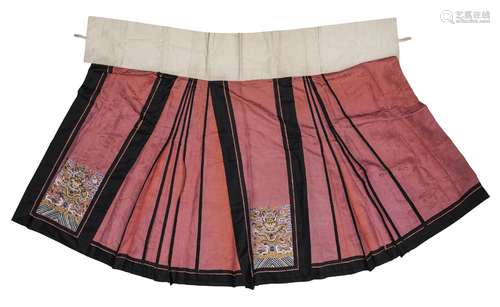 A Chinese kesi silk embroidered skirt, late Qing dynasty, decorated with roundels of phoenix on a