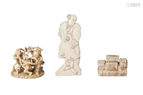 A Japanese ivory netsuke, late 19th century, carved as Shoki fighting two oni, signed to base, 4.5cm