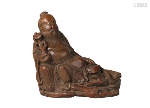 A Chinese bamboo root carving of Dongfang Shuo, 17th/18th century, carved with characteristic