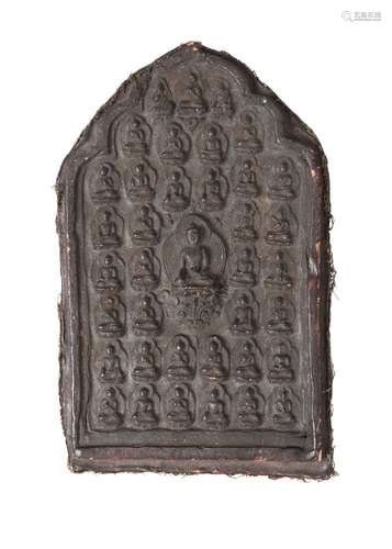 A large Tibetan terracotta votive plaque, 18th/19th century, depicting Shakyamuni Buddha, surrounded